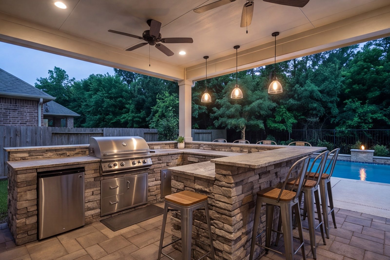 Cypress covered patio with outdoor kitchen, bar seating and ceiling fans